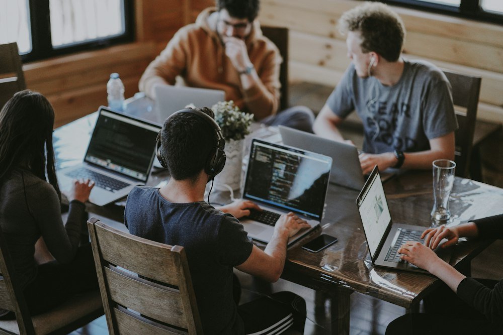 Small business team collaborating in an office meeting on a project.