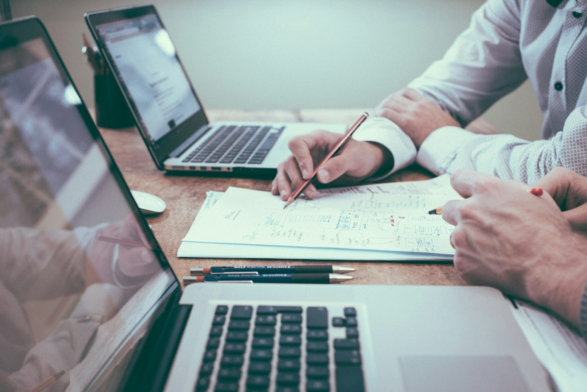 Oregon small business owner and tax advisor reviewing corporate financial projections